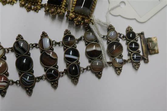 Two banded agate bracelets, one in gilt metal, one in white metal.